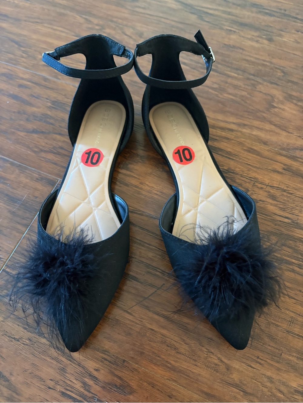 BCBGeneration Black Feather Pom Pointed Ankle-Strap Flats